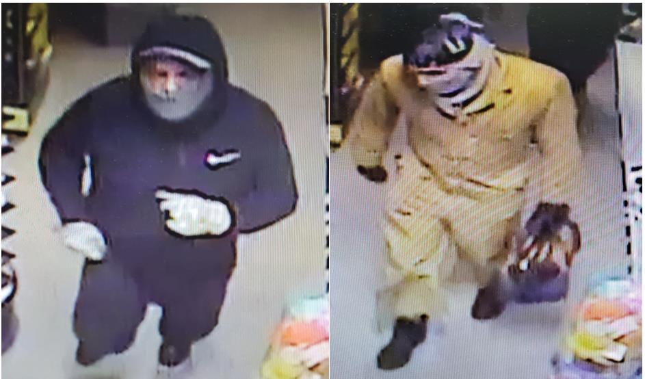 Camera footage photo of two suspects. Left suspect dressed in all black, right suspect dressed in all beige or yellow. Both suspects are wearing hats and masks and gloves.